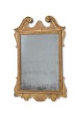 A GEORGE II CARVED GILTWOOD AND GESSO MIRROR, IN THE MANNER OF BENJAMIN GOODISON, CIRCA 1750