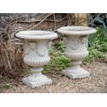 A LARGE PAIR OF FRENCH CAST IRON URNS, IN THE MANNER OF THE VAL D'OSNE FOUNDRY