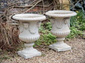 A LARGE PAIR OF FRENCH CAST IRON URNS, IN THE MANNER OF THE VAL D'OSNE FOUNDRY
