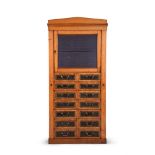 AN UNUSUAL VICTORIAN OAK COMBINED CUPBOARD AND CHEST, OF 'WELLINGTON' TYPE, LATE 19TH CENTURY