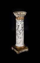 A FRENCH VARIAGATED WHITE MARBLE AND GILT METAL MOUNTED PEDESTAL COLUMN, SECOND HALF 19TH CENTURY