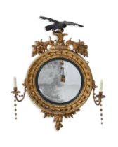 A REGENCY GILTWOOD CONVEX GIRANDOLE MIRROR, CIRCA 1815