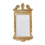 A GEORGE II CARVED GILTWOOD PIER MIRROR, CIRCA 1730