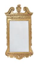 A GEORGE II CARVED GILTWOOD PIER MIRROR, CIRCA 1730