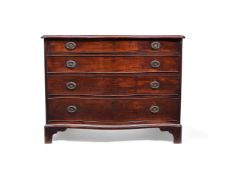 A GEORGE III 'FIDDLEBACK' MAHOGANY SERPENTINE FRONTED COMMODE, CIRCA 1770