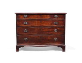 A GEORGE III 'FIDDLEBACK' MAHOGANY SERPENTINE FRONTED COMMODE, CIRCA 1770