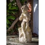 A COMPOSITION STONE FIGURE OF A PIPING FAUN SEATED ON A STUMP, OF RECENT MANUFACTURE