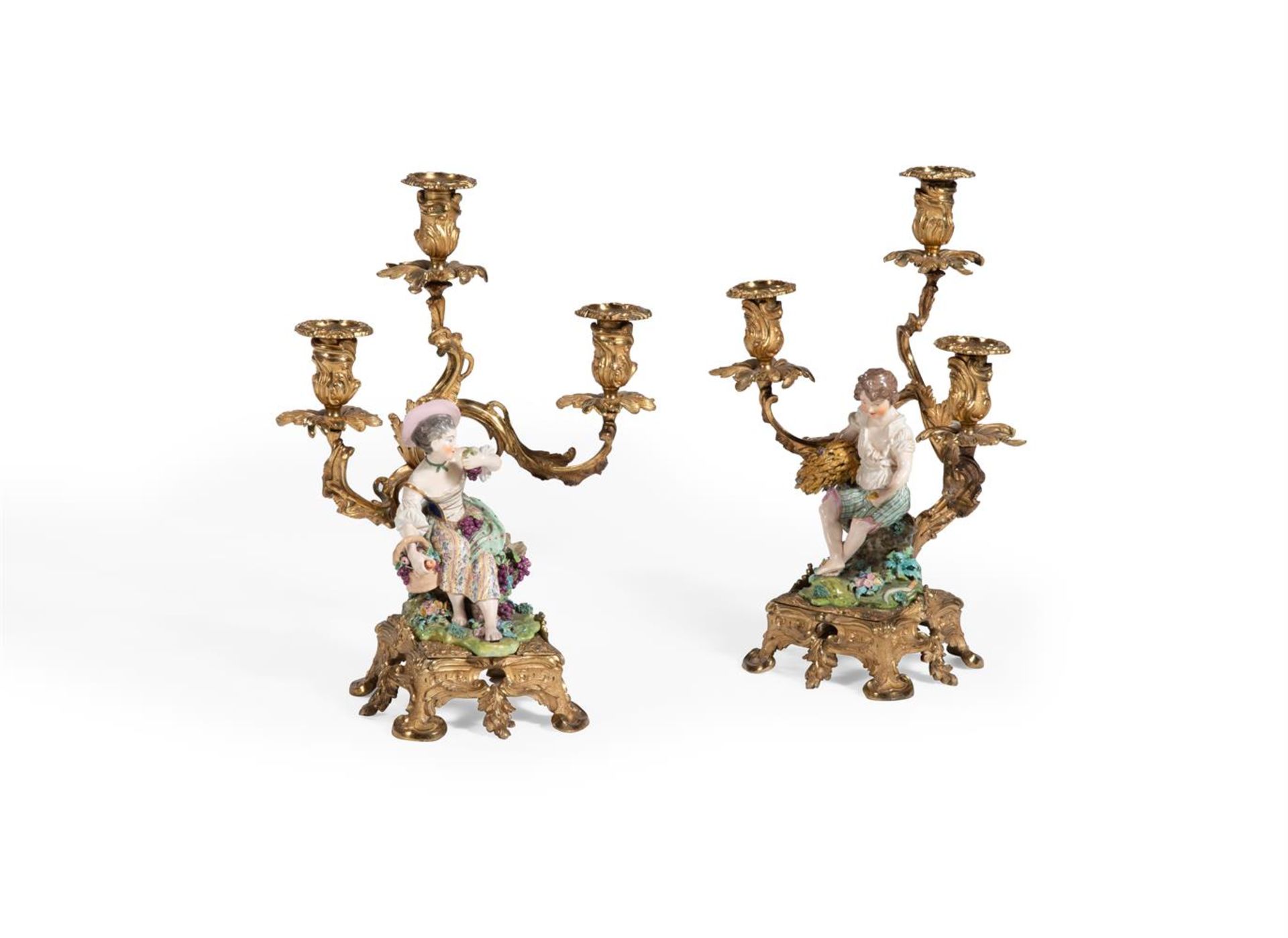 A PAIR OF ORMOLU MOUNTED MINTON PORCELAIN THREE LIGHT CANDELABRA EARLY 19TH CENTURY With Minton po