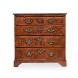 A GEORGE II WALNUT AND FEATHER BANDED CHEST OF DRAWERS, CIRCA 1740