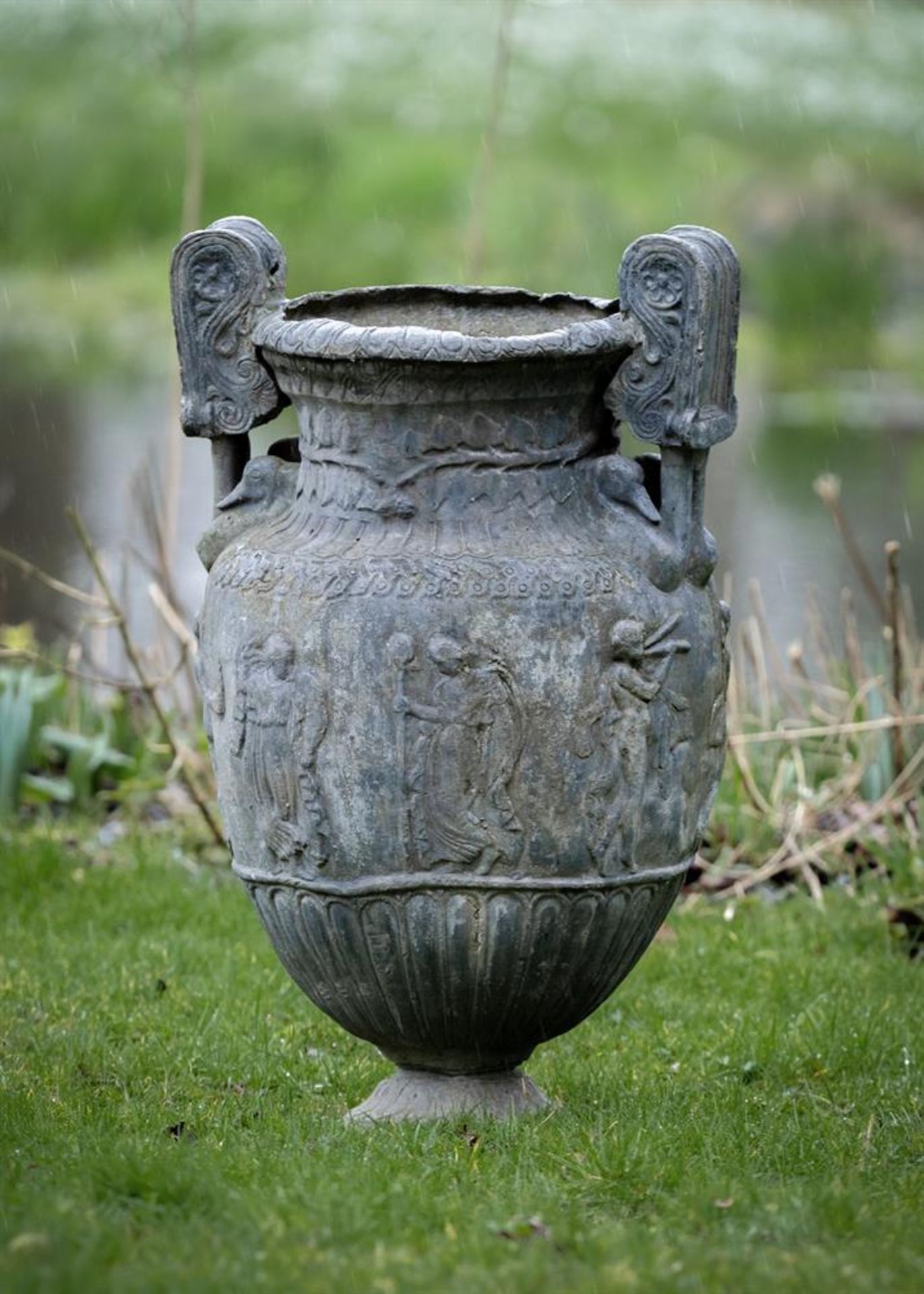 AFTER THE ANTIQUE 'SOSIBIOS VASE'- A LARGE LATE GEORGE III LEAD CLASSICAL URN, EARLY 19TH CENTURY