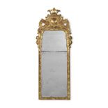 A GEORGE I CARVED GILTWOOD MIRROR, CIRCA 1725