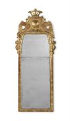 A GEORGE I CARVED GILTWOOD MIRROR, CIRCA 1725