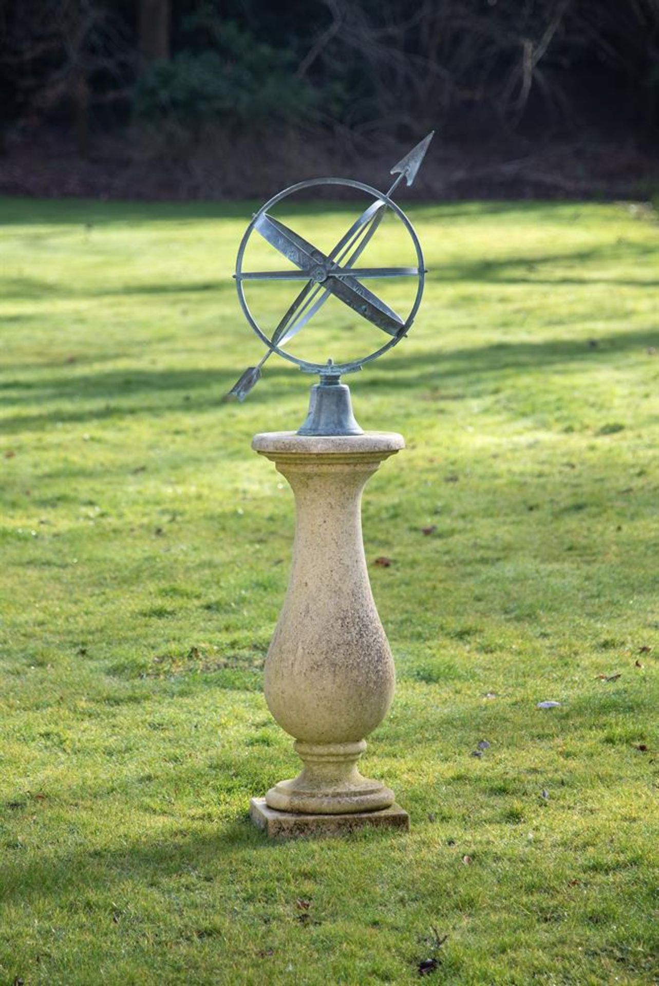 A VERDIGRIS METAL ARMILLARY SPHERE ON A COMPOSITION STONE PEDESTAL, OF RECENT MANUFACTURE