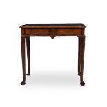 A GEORGE II WALNUT, CROSSBANDED AND FEATHERBANDED SIDE TABLE, CIRCA 1730