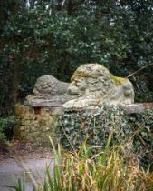 AFTER CANOVA, A PAIR OF COMPOSITION STONE FIGURES OF THE REZZONICO LIONS, 20TH CENTURY