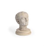 AFTER THE ANTIQUE, A CARVED MARBLE HEAD OF AN EMPEROR, PROBABLY ITALIAN, EARLY 19TH CENTURY