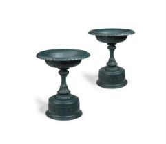 A LARGE PAIR OF VICTORIAN CAST IRON PEDESTAL URNS, IN THE MANNER OF HANDYSIDE, CIRCA 1870-1890