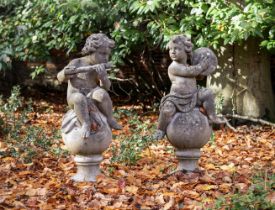 A PAIR OF COMPOSITION STONE FIGURAL FINIALS, IN THE 18TH CENTURY STYLE, MODERN