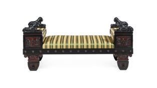AN EBONISED AND UPHOLSTERED SETTEE OR WINDOW SEAT, IN REGENCY STYLE, AFTER A DESIGN BY THOMAS HOPE