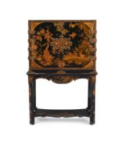 A BLACK LACQUER AND GILT CHINOISERIE DECORATED CABINET ON STAND, 18TH CENTURY