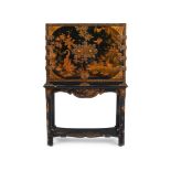 A BLACK LACQUER AND GILT CHINOISERIE DECORATED CABINET ON STAND, 18TH CENTURY