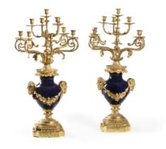 A PAIR OF ORMOLU MOUNTED BLUE PORCELAIN TEN LIGHT URN CANDELABRA, FRENCH, EARLY 20TH CENTURY