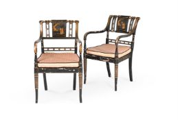 A PAIR OF EBONISED AND PARCEL GILT ARMCHAIRS, IN REGENCY STYLE