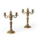 A PAIR OF FRENCH GILT BRONZE THREE LIGHT CANDLESTICKS, 18TH CENTURY AND LATER