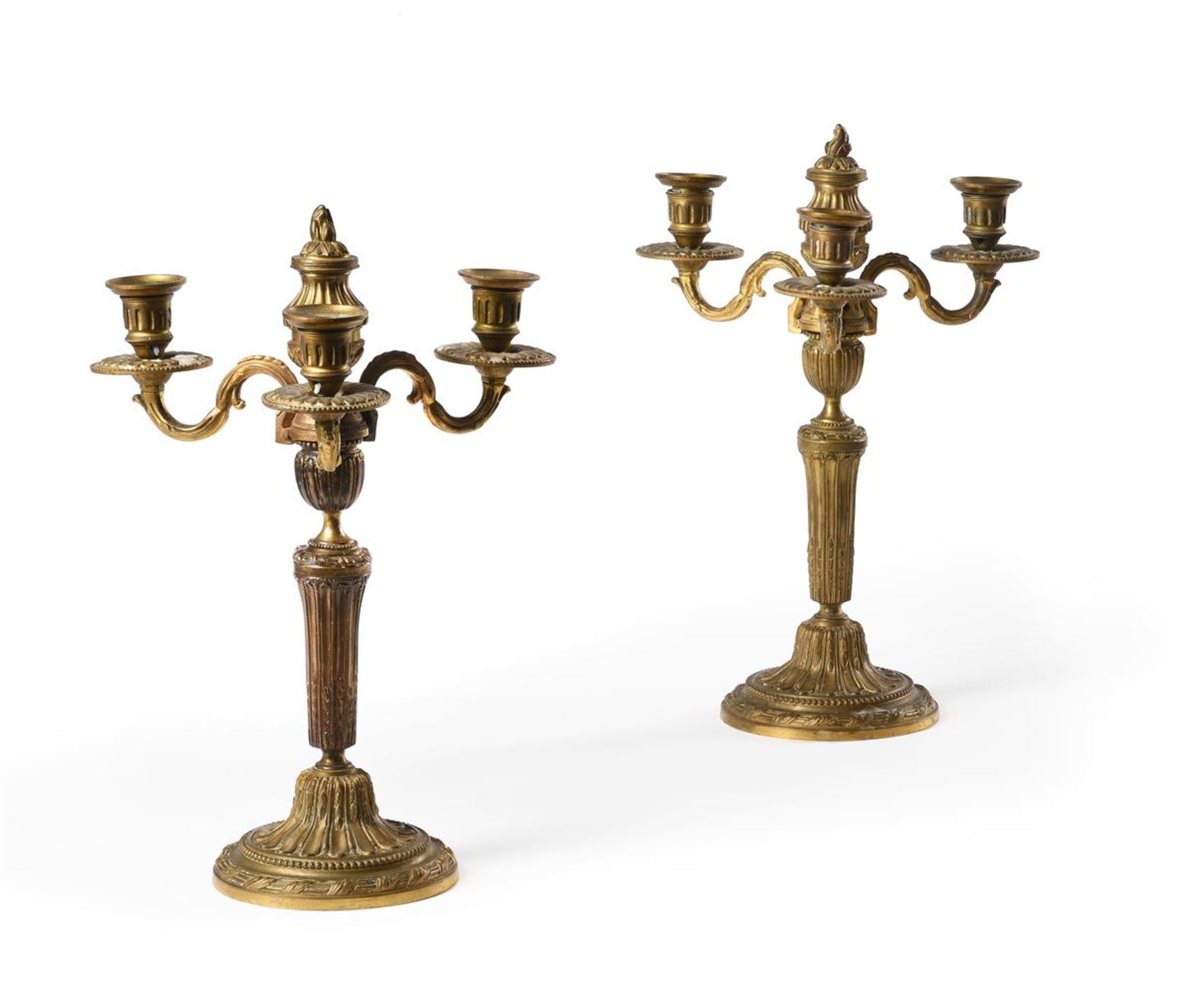 A PAIR OF FRENCH GILT BRONZE THREE LIGHT CANDLESTICKS, 18TH CENTURY AND LATER