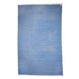 A BLUE GROUND 'RAG' RUG BY SHYAM AHUJA