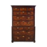 A GEORGE II WALNUT AND FEATHERBANDED CHEST ON CHEST, CIRCA 1740