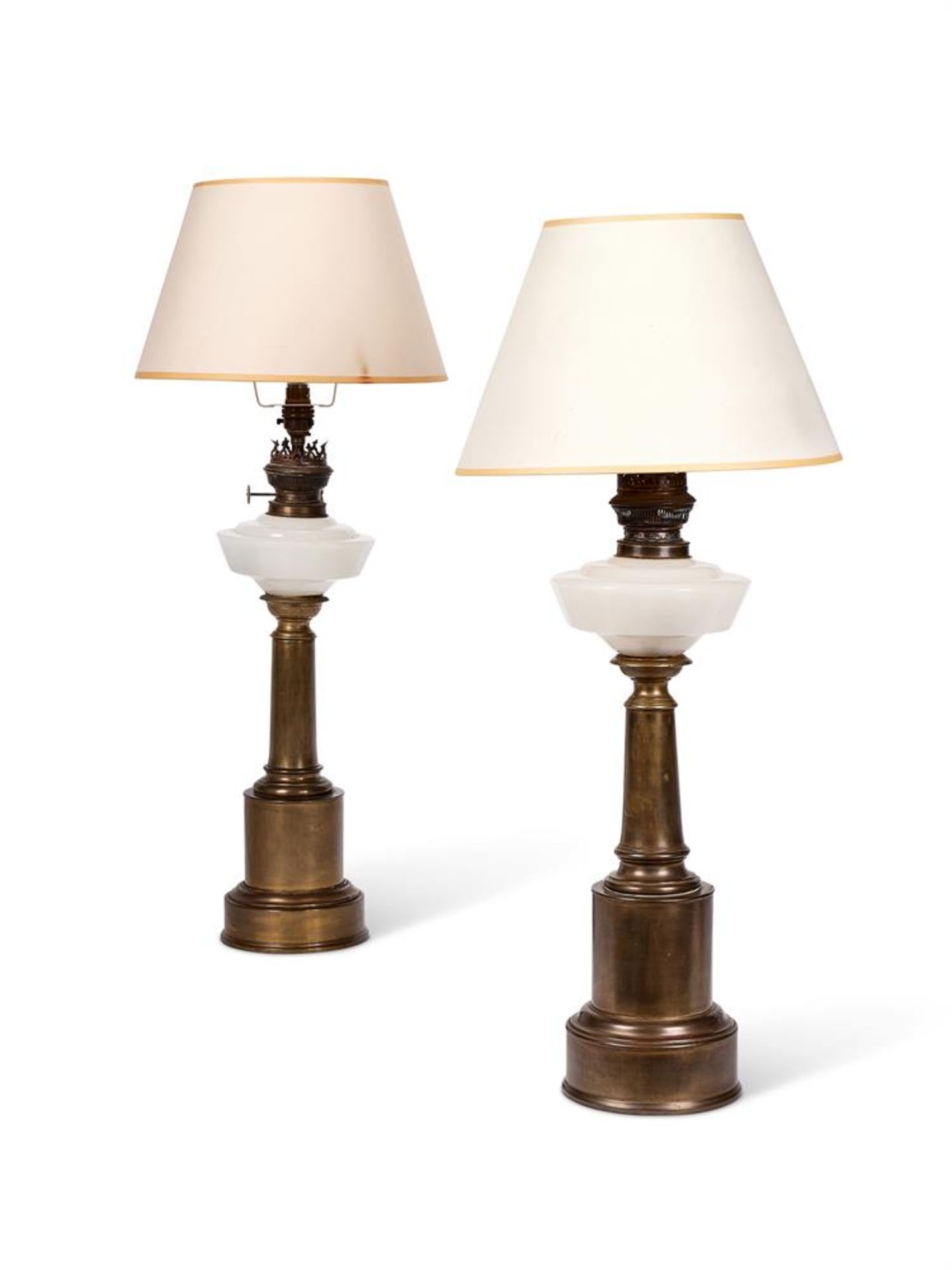 A PAIR OF COLUMNAR BRASS AND OPAQUE GLASS OIL LAMP BASES, LATE 19TH CENTURY AND LATER