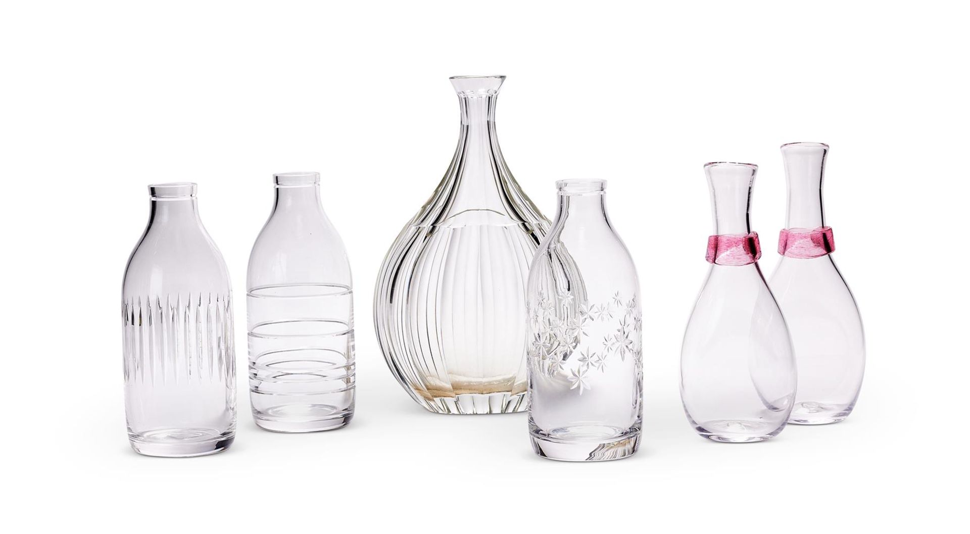 A SET OF THREE ENGRAVED CUT GLASS BOTTLES BY SAMANTHA SWEET