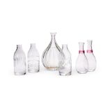 A SET OF THREE ENGRAVED CUT GLASS BOTTLES BY SAMANTHA SWEET