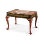 A WALNUT AND TAPESTRY UPHOLSTERED STOOL IN THE GEORGE II STYLE, 20TH CENTURY