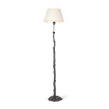 A PATINATED METAL STANDARD LAMP IN THE MANNER OF GIACOMETTI, MODERN
