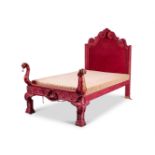 A LARGE RED VELVET UPHOSTERED SINGLE BED IN THE LATE 17TH CENTURY STYLE, EARLY 20TH CENTURY