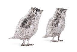 A PAIR OF GERMAN SILVER COLOURED OWL PEPPERETTES