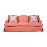 A PINK UPHOLSTERED THREE SEAT SOFA, MODERN