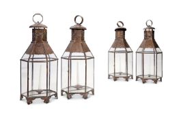 A GROUP OF FOUR NORTH AFRICAN SHEET BRASS AND GLAZED HEXAGONAL SECTION LANTERNS, MODERN