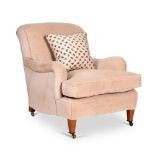 A BEIGE UPHOLSTERED ARMCHAIR, MODERN