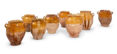A GROUP OF EIGHT FRENCH POTTERY CONFIT POTS