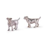 A PAIR OF EDWARDIAN SILVER DOG PEPPERETTES