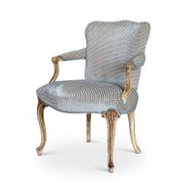 A GEORGE III PAINTED AND PARCEL GILT ARMCHAIR IN THE HEPPLEWHITE MANNER, CIRCA 1770