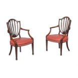 A PAIR OF GEORGE III MAHOGANY AND LEATHERETTE UPHOLSTERED ARMCHAIRS, CIRCA 1800