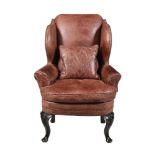 A MAHOGANY AND LEATHER UPHOLSTERED WING ARMCHAIR, SECOND HALF 18TH CENTURY AND LATER