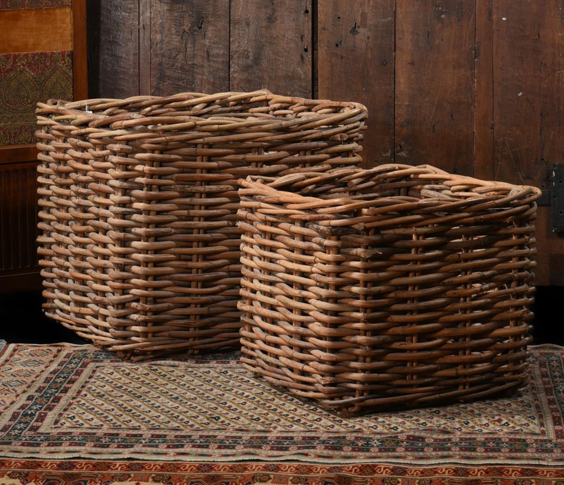 TWO GRADUATED WICKER LOG BASKETS