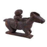 A TIMOR CARVED WOODEN FIGURE OF A HORSE AND RIDER