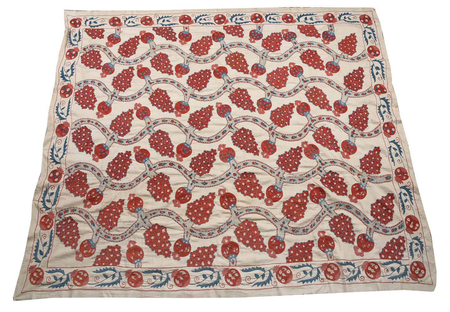 A SUZANI WOVEN WITH A POMEGRANATE DESIGN