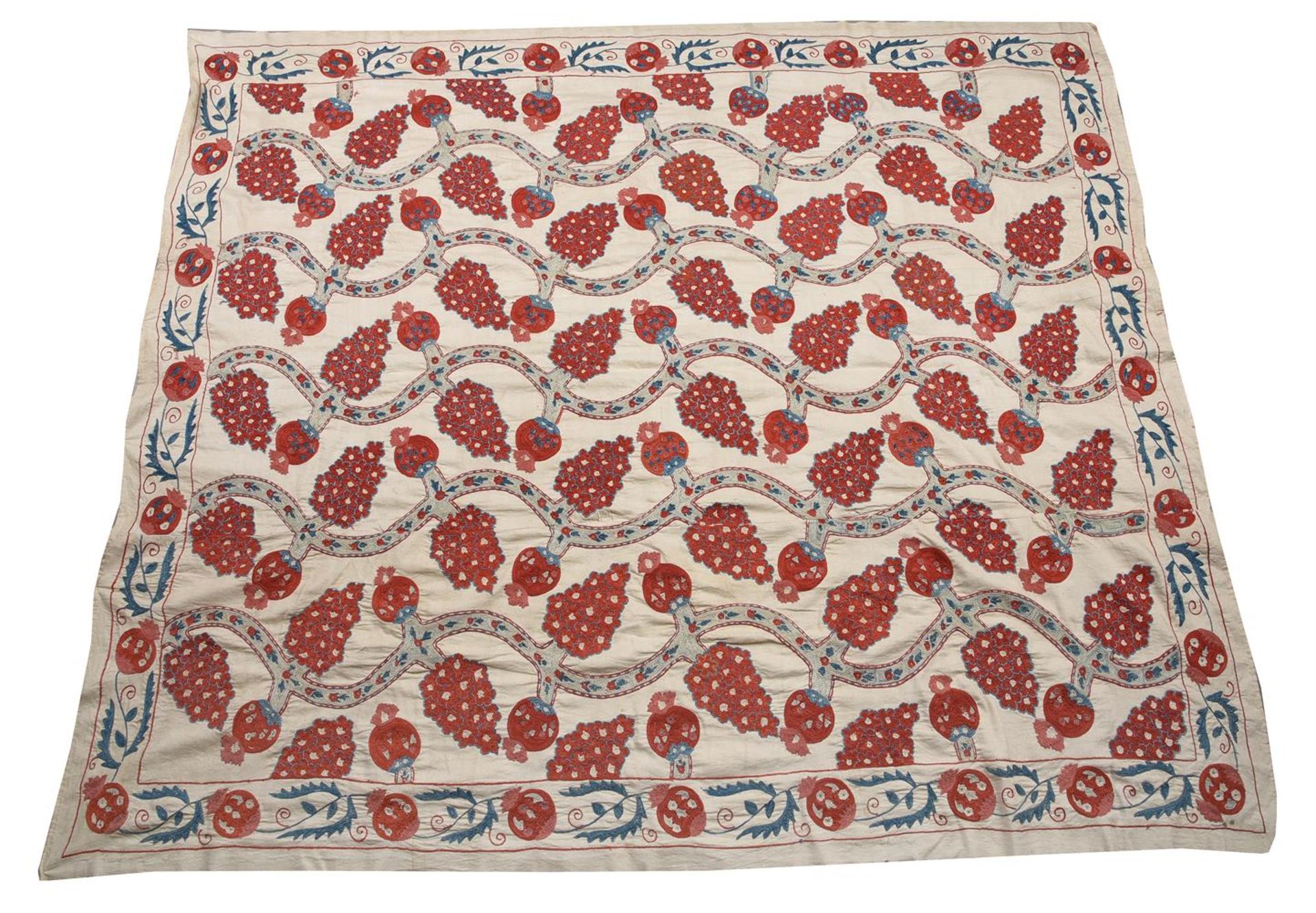 A SUZANI WOVEN WITH A POMEGRANATE DESIGN